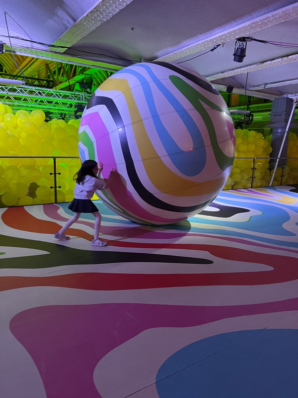From a pool-style ball pit complete with ladders and a projection ball to the playful setups in Balloon Street, it's an invitation to immerse yourself in art and share your joy with the world.