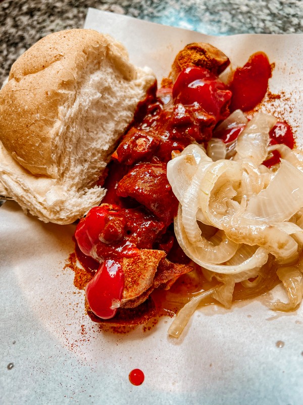Lunch on Potsdamer Platz, currywurst, food in Berlin